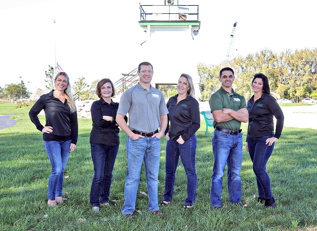 Agency Photo - Frederick Agency Inc. Team Standing Outside in Front of the Port Clinton Lighthouse on a Sunny Day